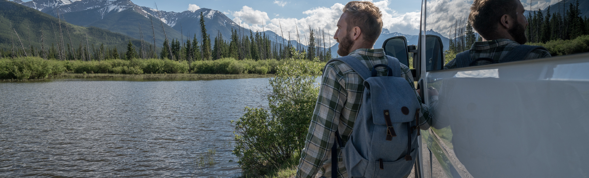 Recreational_Vehicles_Man_standing_beside_camper